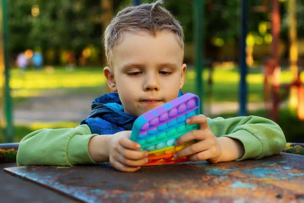 Boy Holding in His Hands a Sensory Toy&nbsp;