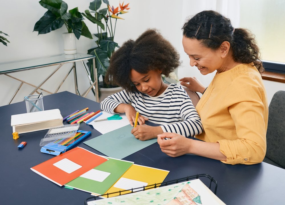 African American Girl Doing An Activity Guided By Her ABA Therapist