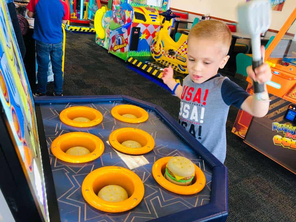Young child playing at Chuck E Cheese