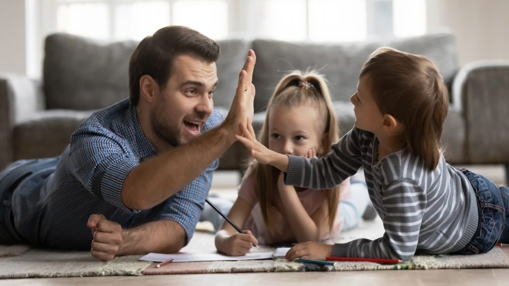 Father Uses High-Five as a Positive Reinforcer for Son 