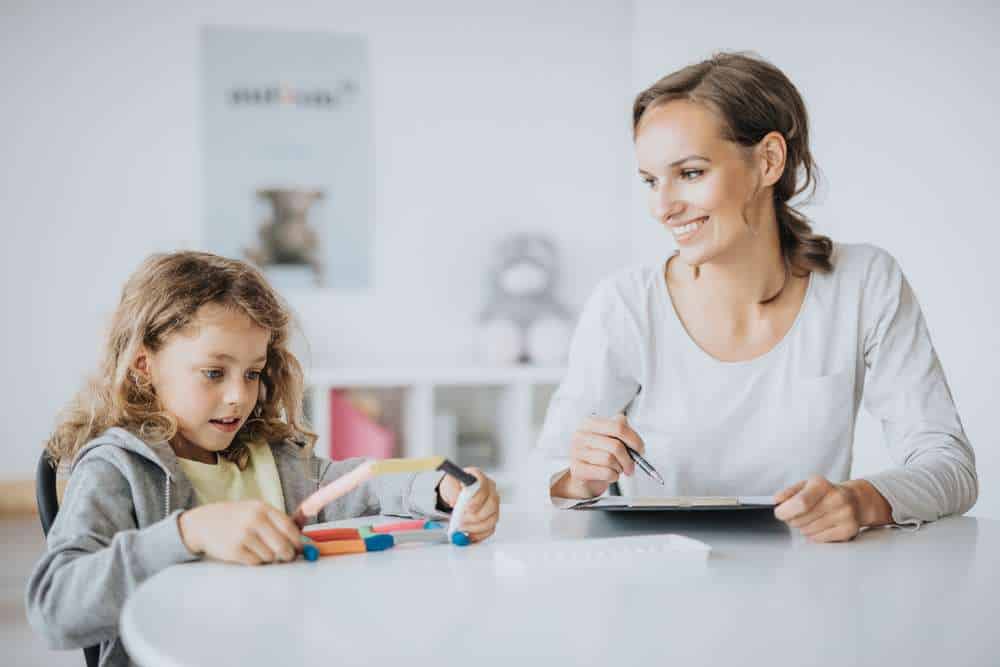 Young girl at school with teacher