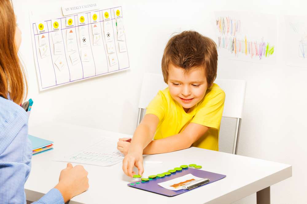 Boy with autism doing an autism assessment